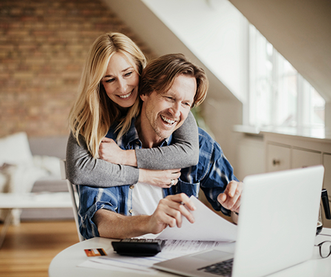 Couple using a laptop computer